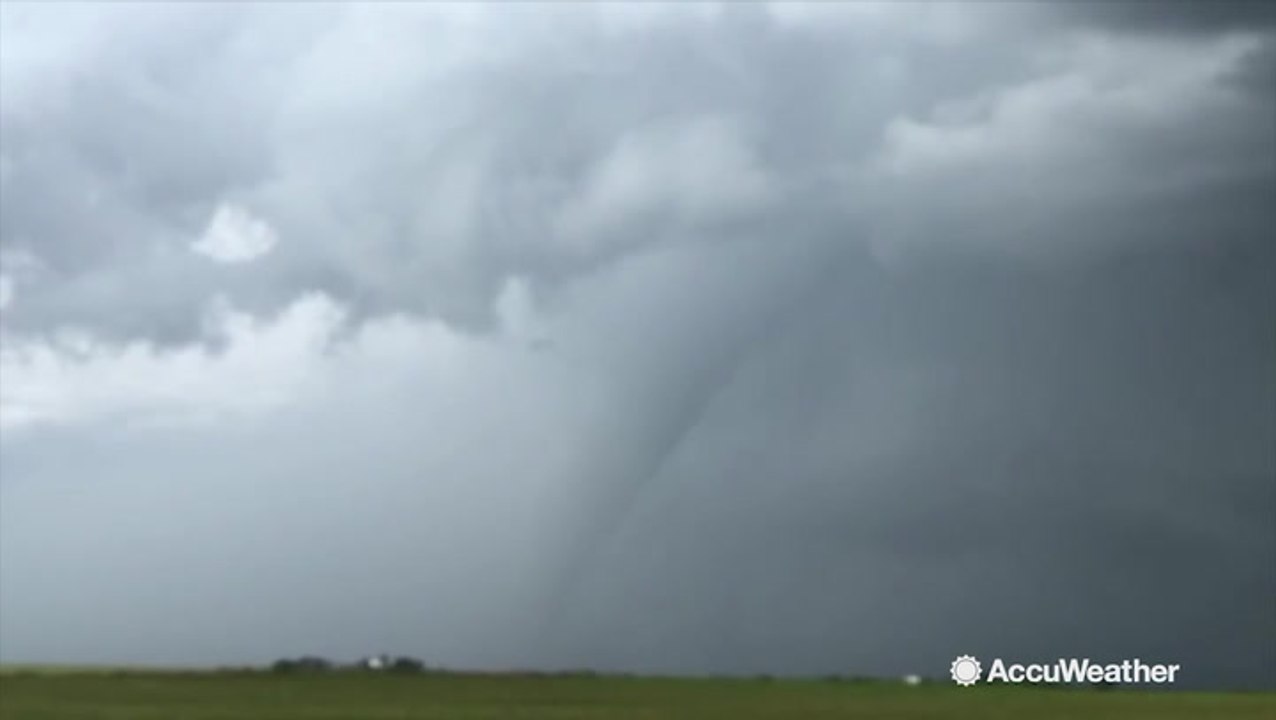 Tornado glides through field