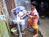 little kids playing recycle drum at market - these are superb