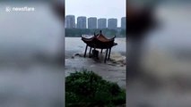 Buildings and roads collapse in flooding caused by typhoon Lekima in China