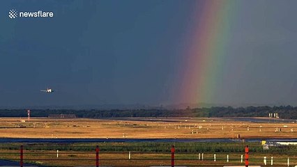 Plane lands at German airport with a stunning rainbow backdrop
