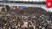 Hong Kong airport cancels flights as thousands peacefully protest