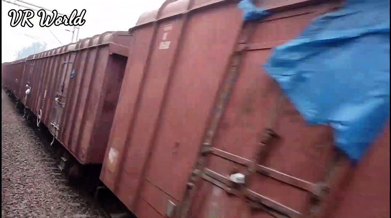 Emu passing cement frieght train