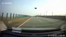 Bonnet smashes car window after being blown off by strong winds in China