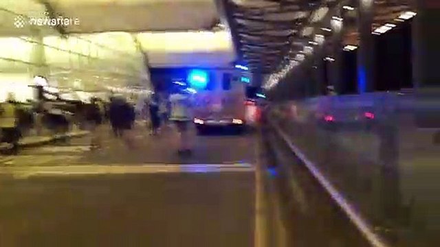 Hong Kong police chase after protesters following police vehicle vandalization at airport