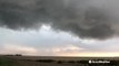 Ominous funnel cloud looms overhead in tornado-warned storm