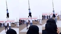 شاهد: فتاة سعودية معلقة من أقدامها في الهواء