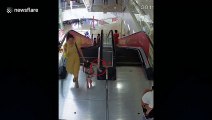 Five-year-old girl gets her arm stuck in escalator handrail at a mall in China