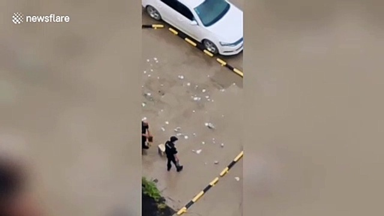 Security guards in China smash glass bottles on ground to 'stop residents parking there'