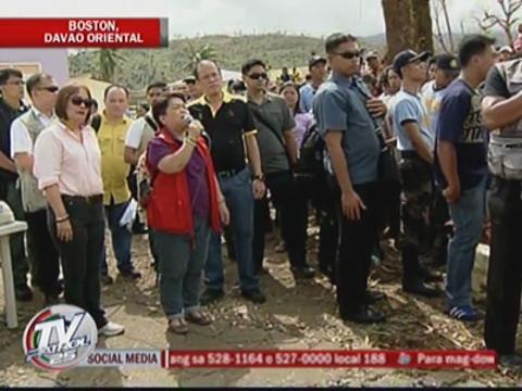PNoy hands relief goods in typhoon-hit Davao Oriental