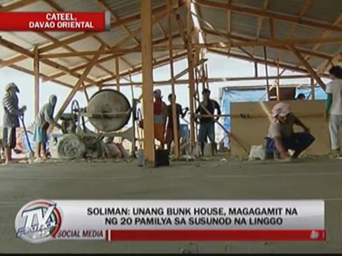 Cateel residents endure rains for relief goods