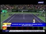 Djokovic battles through opening match