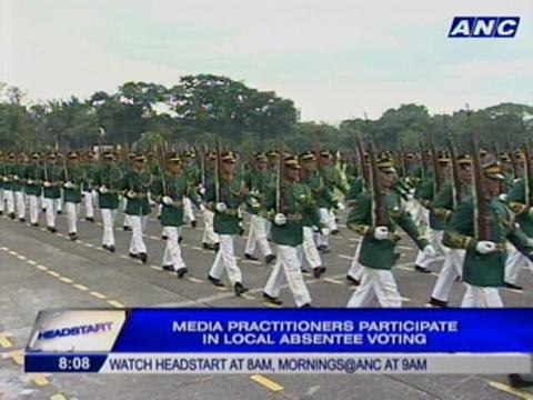 Media practitioners participate in local absentee voting