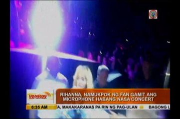Rihanna hits fan with microphone