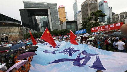 Tens of thousands brave the rain to show support for Hong Kong police