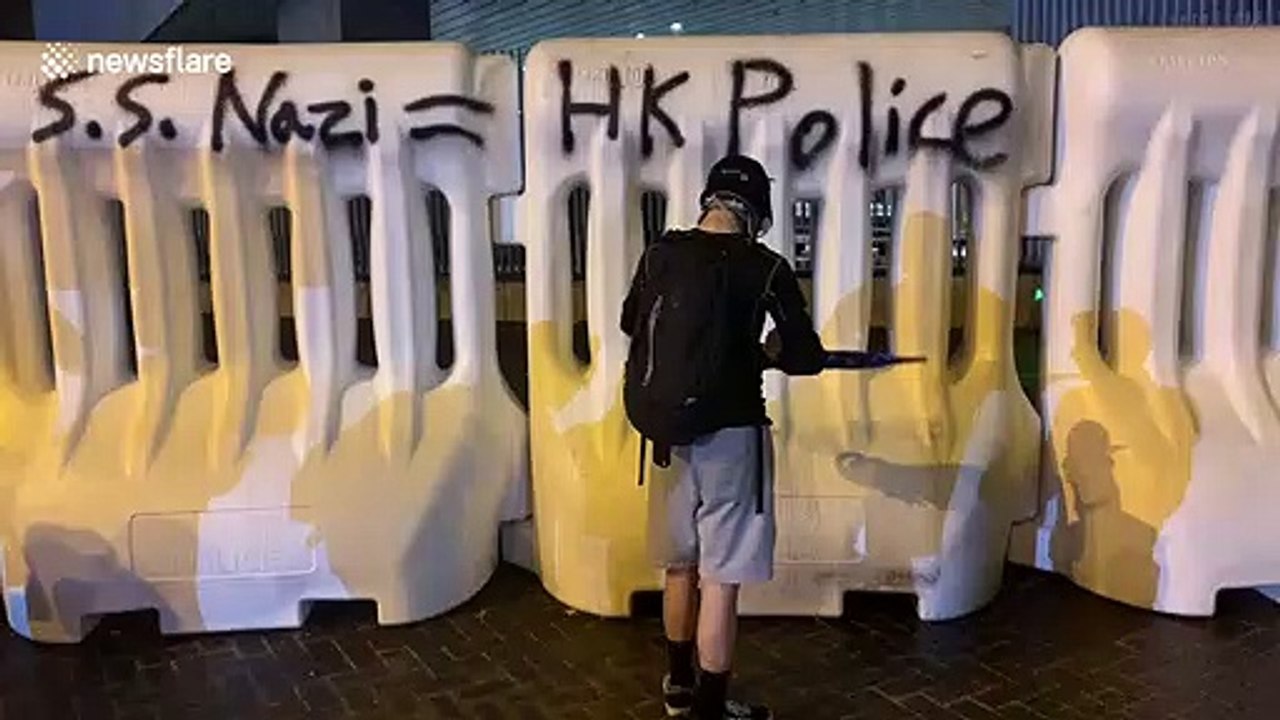 Hong Kong activists spray "S.S. Nazi = H.K. Police" on police bollard as protests escalate