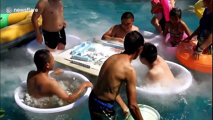 Chongqing residents enjoy giant 5 kg ice lollies to stay cool during heatwave