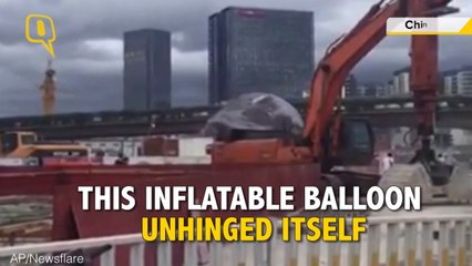 Giant Moon Balloon Lands on a Busy Road in China