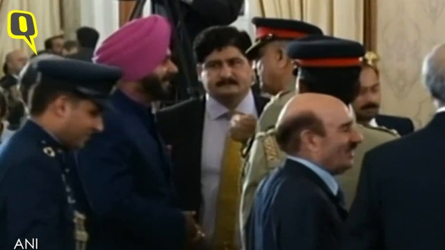 Navjot Singh Sidhu and Pak Army Chief General Qamar Javed Bajwa greet each other at Imran Khan's Swearing-In Ceremony