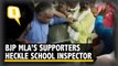 Supporters of BJP MLA Surendra Singh heckle District School Inspector in UP's Ballia