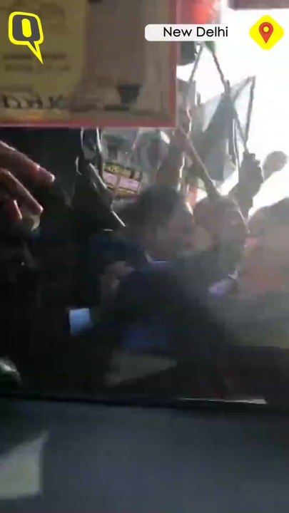 Arvind Kejriwal's car attacked by protestors waving BJP flags