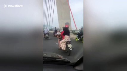 'Basket case biker' spotted on Vietnam highway with bread balancing on his head