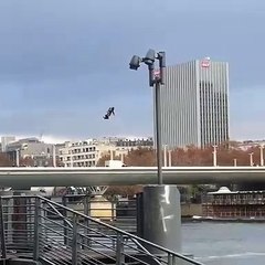 A soldier flies over Seine with hoverboard