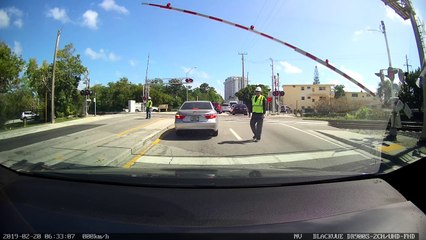 Car Nearly Clipped by Passing Train