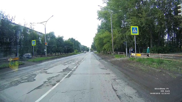 Pedestrian Runs During Red Light, Narrowly Avoids Car