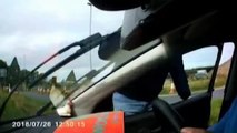SWNS - Driver jumps out of his car and attacks him in the middle of a busy dual carriage way