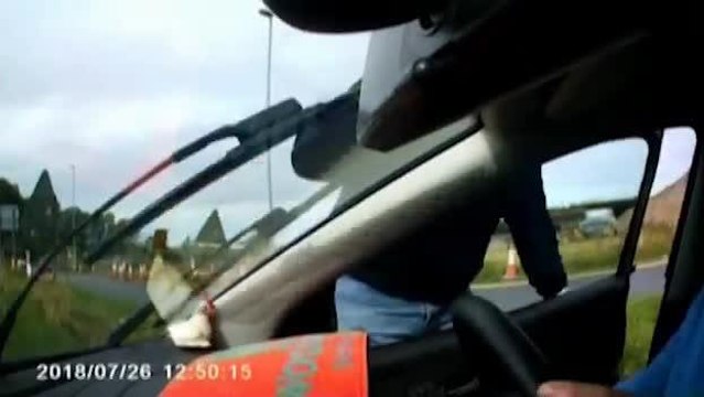 SWNS - Driver jumps out of his car and attacks him in the middle of a busy dual carriage way