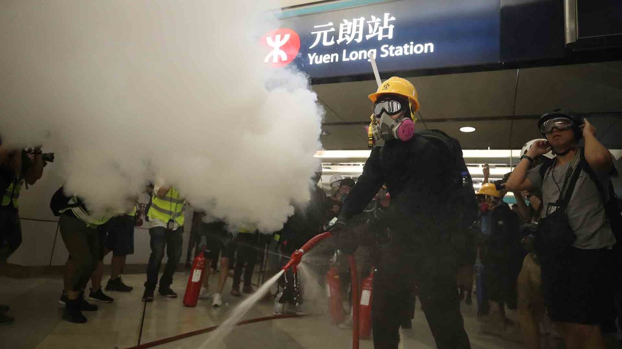 Hong Kong protesters stage sit-in at Yuen Long MTR station to remind passengers of violent attack