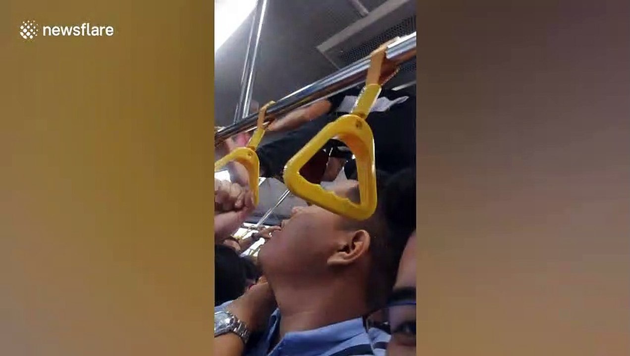 Bus conductor in the Philippines dubbed 'Spider-man' as he climbs over passengers' heads to collect fares