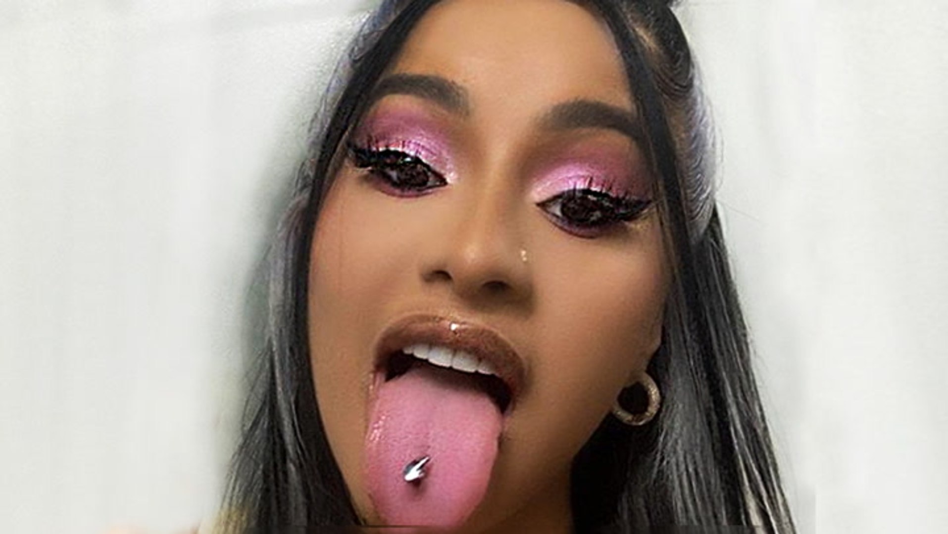 Cardi b deals tongue piercing