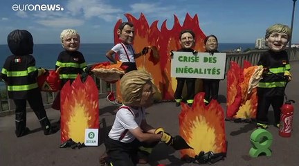 شاهد: مظاهرة "الرؤوس الكبيرة" لمطالبة قادة قمة الدول السبع بالحد من الفقر