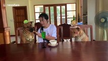 Pampered rescue dogs enjoy lunch at dining table