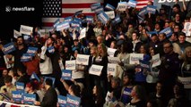 Crowd chants 'Not Me. Us' as Bernie Sanders takes the stage in Iowa despite delay in results