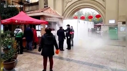 Chinese residents walk through five-metre-long disinfectant tunnel to enter community amid coronavirus outbreak