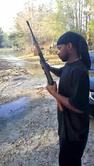 The black rambo showing off his gunplay /faring video