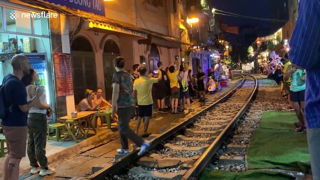Tourists flock to Train Street in Hanoi, Vietnam