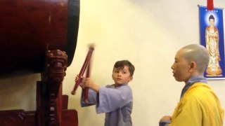 Boy drumming at Buddhist Temple