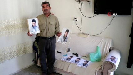 Elindeki fotoğraflarla sokak sokak oğlunu arıyor