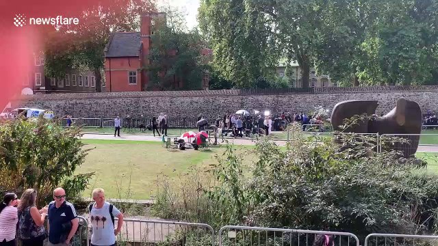 Journalists and protesters gather in Westminster after Parliament suspension announcement