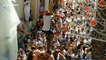 Residents in Spain battle to climb a pole during the infamous La Tomatina festival