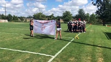 Tough Football Banner Prevents Team Entrance