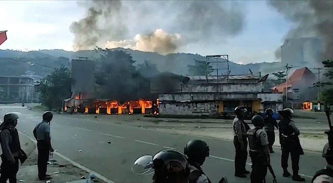 Indonesian protesters set a government building on fire as civil unrest continues