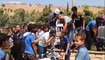 قوات تركية تطلق الغاز المسيل للدموع لتفريق متظاهرين سوريين بالقرب من معبر باب الهوى