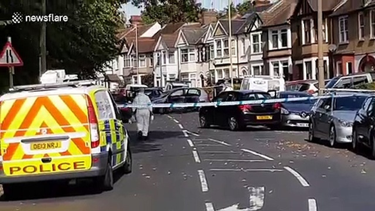 Police at the scene of a multiple stabbing in Watford, outside London