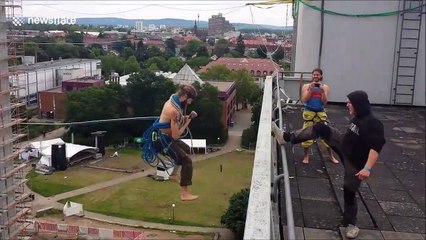 Daredevil Friedi Kuehne slacklines and ropeswings between office buildings