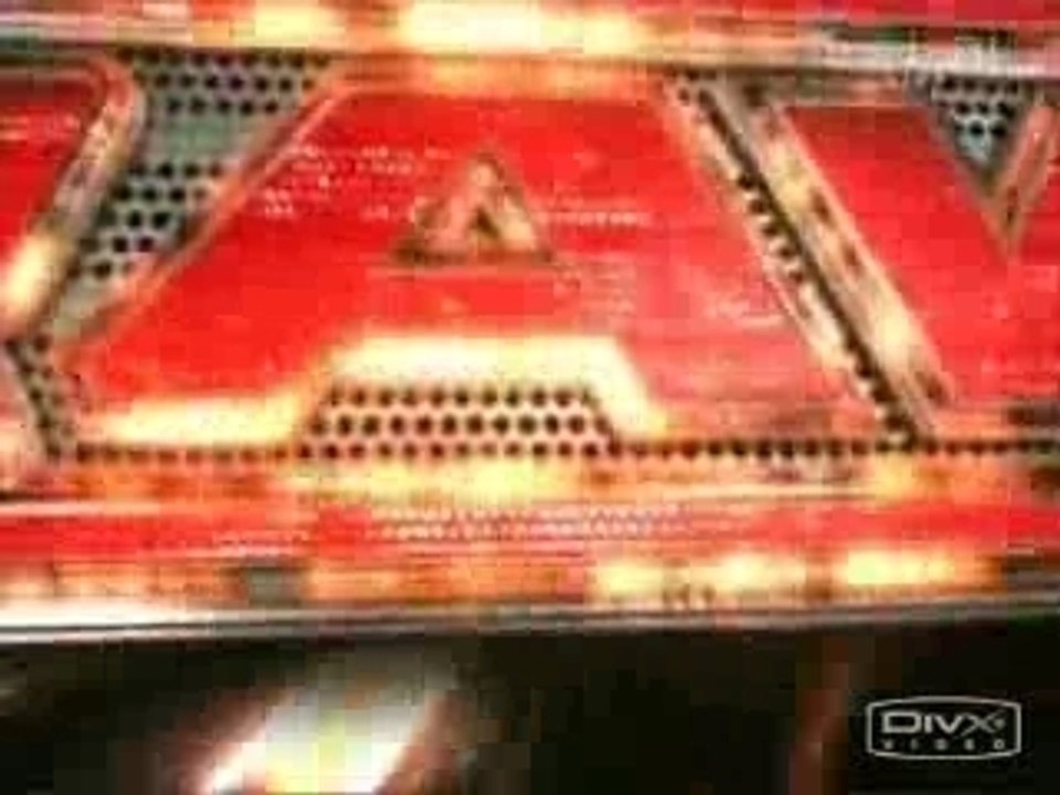HHH knocks the camera man over