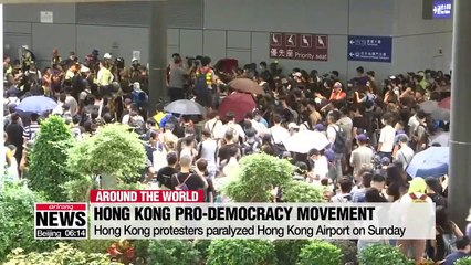 Hong Kong protesters set fire to barricades and block roads to Hong Kong International Airport
